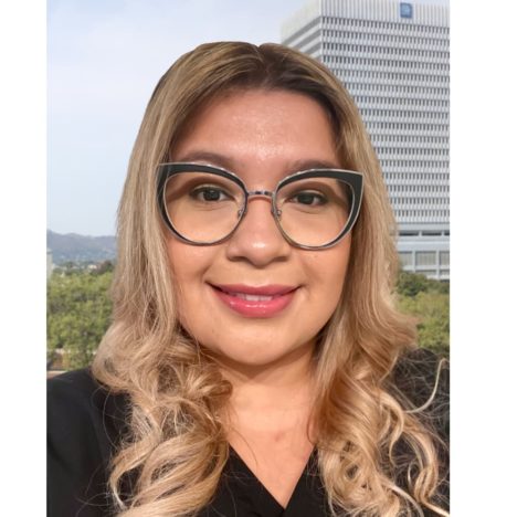 Delmy with city in building and trees