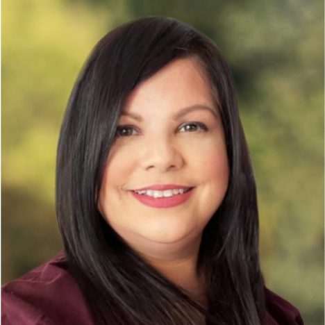 Woman wearing maroon blouse