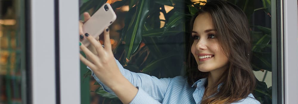 attractive woman taking selfie